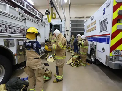 Group trying on Firefighter Gear